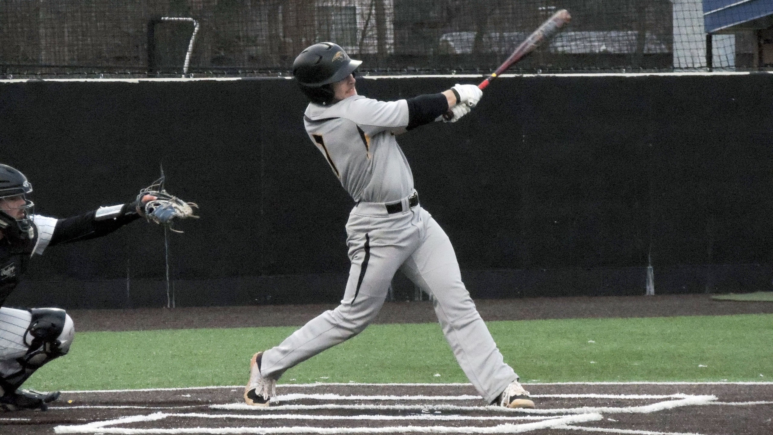 Jake Surane had two of the Titans' four hits against Millikin University.