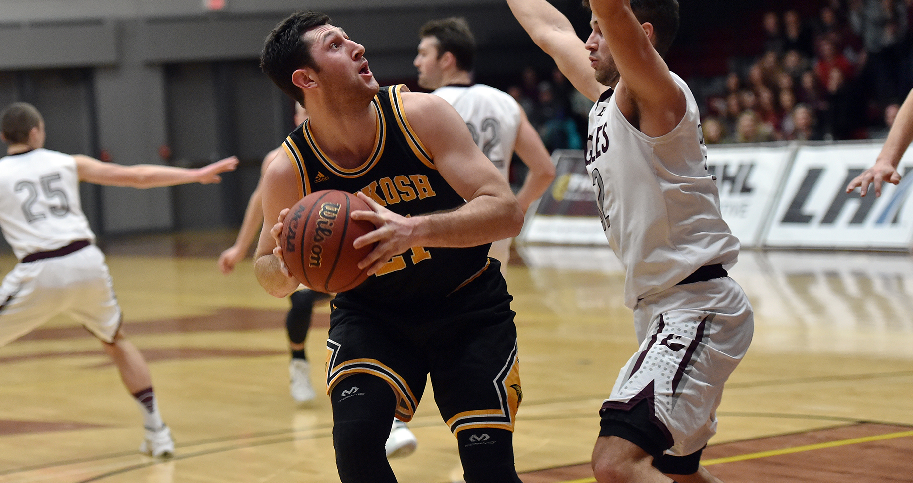 AJ Mueller scored 13 points and grabbed seven rebounds to lead the Titans to their regular-season sweep of the Eagles.