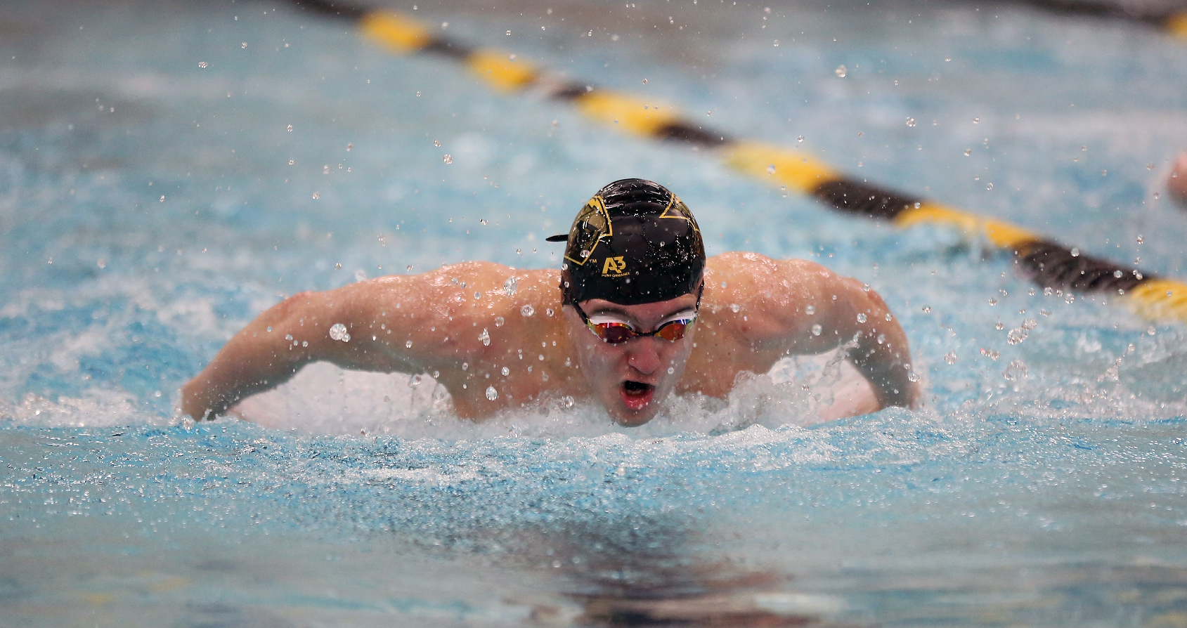 Josiah Vandenberg earned first-place finishes against the Eagles in the 100-yard butterfly and 200-yard individual medley.