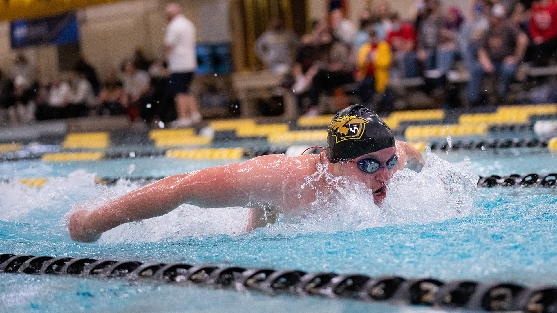 Hayden Freeman won the 200-yard butterfly while finishing second in the 1,650-yard freestyle against the Red Hawks.