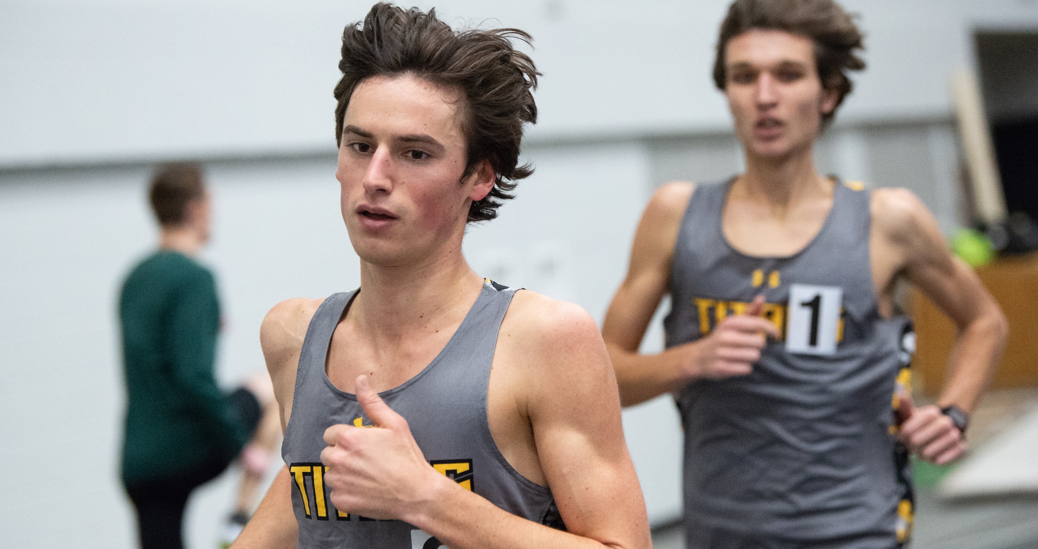 Lucas Weber (left) finished first and Cody Chadwick third in the 3,000-meter run at the Olivet Nazarene University Holiday Invitational.