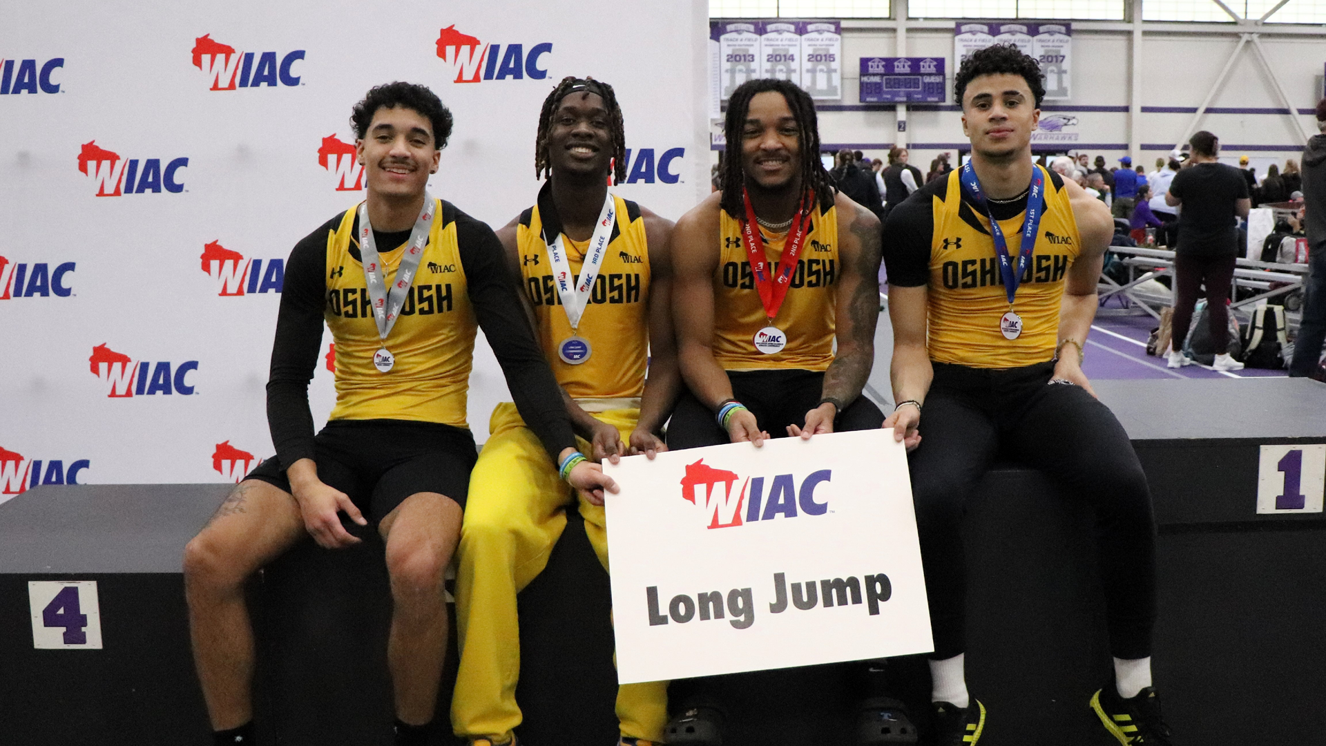 Left to right: Charlie Nolan, Caleb Wright, Londyn Little and Joshua Rivers after placing in the long jump on Friday. Photo Credit: Autumn Krause, UW-Whitewater Sports Information