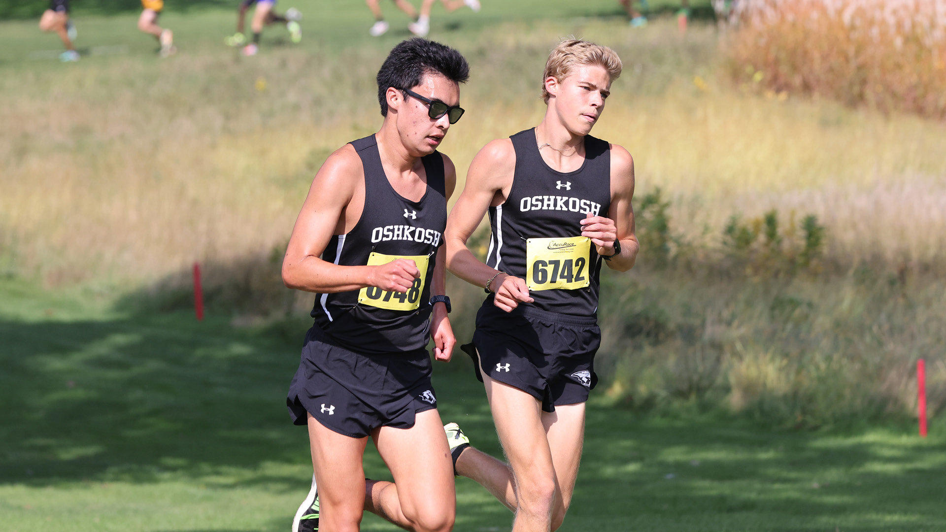 Joe Kehoe (left) and Cameron Cullen (right) were the fifth- and second-fastest Titan runners at the Blugold Invitational