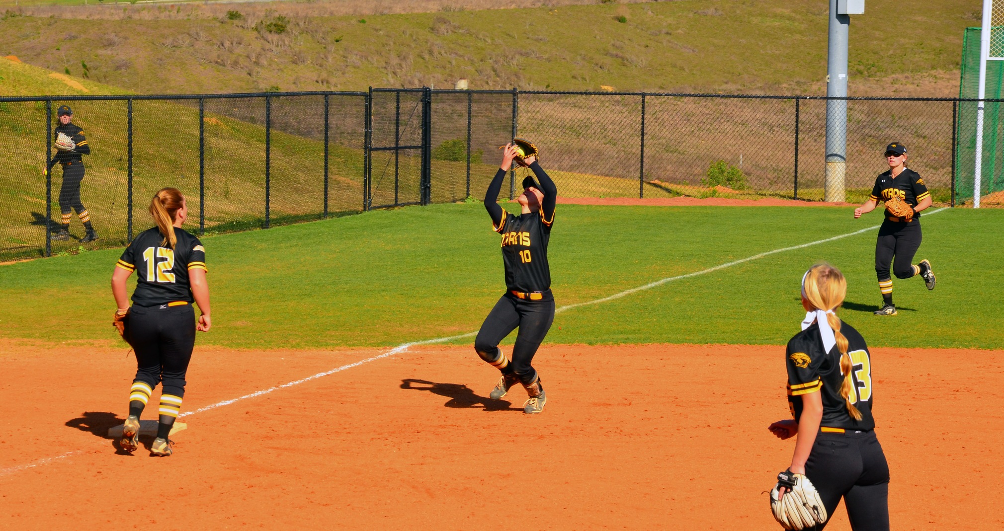 The Titans salvaged a split with a nine-run inning against Farmingdale State College.