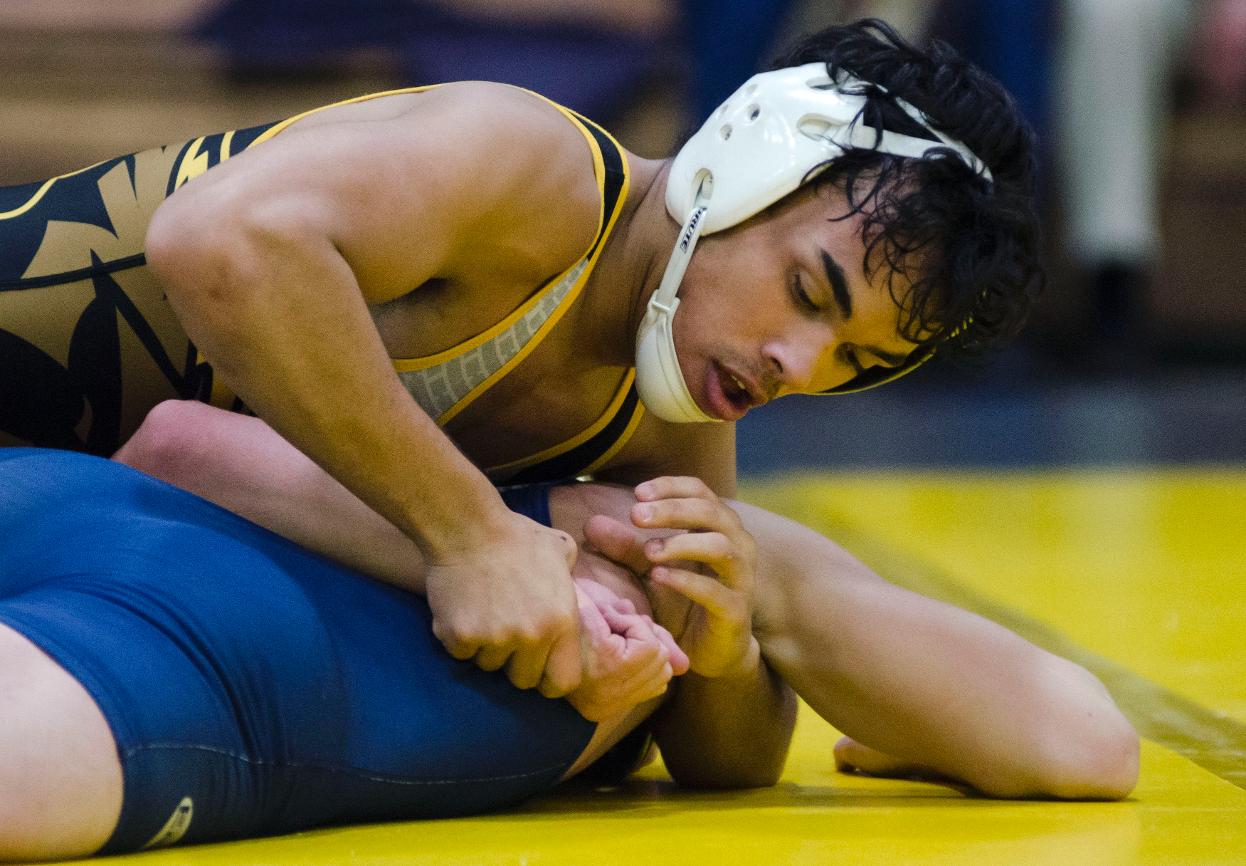 Jonathan Flores earned UW-Oshkosh's first victory of the match with his pin of Scott Worlund in 4:35.