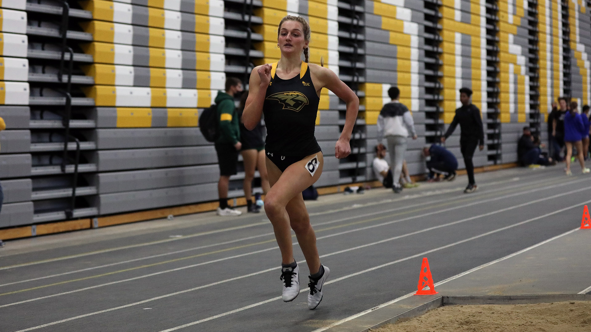 Libby Geisness finished second in the 800-meter run at the Titan Challenge.