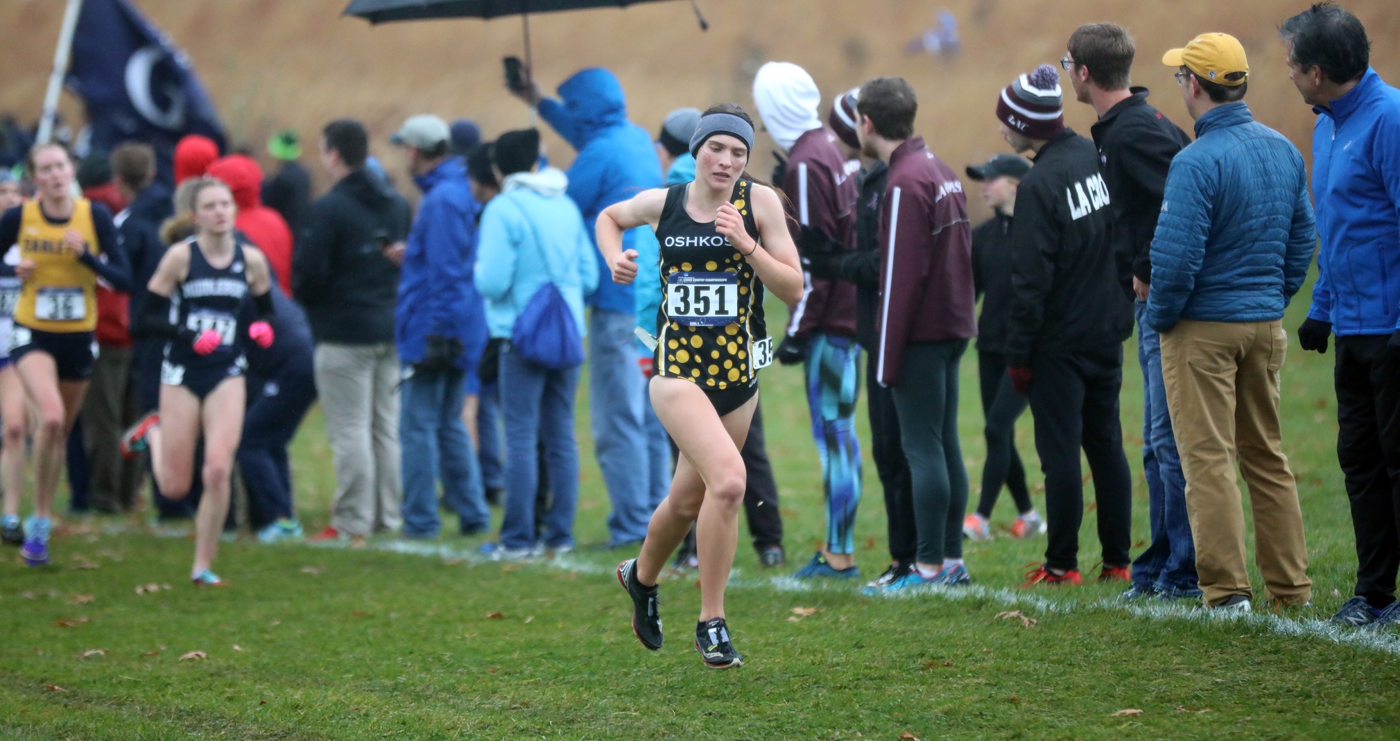 Cheyenne Moore earned All-America honors in her final cross country race as a Titan.