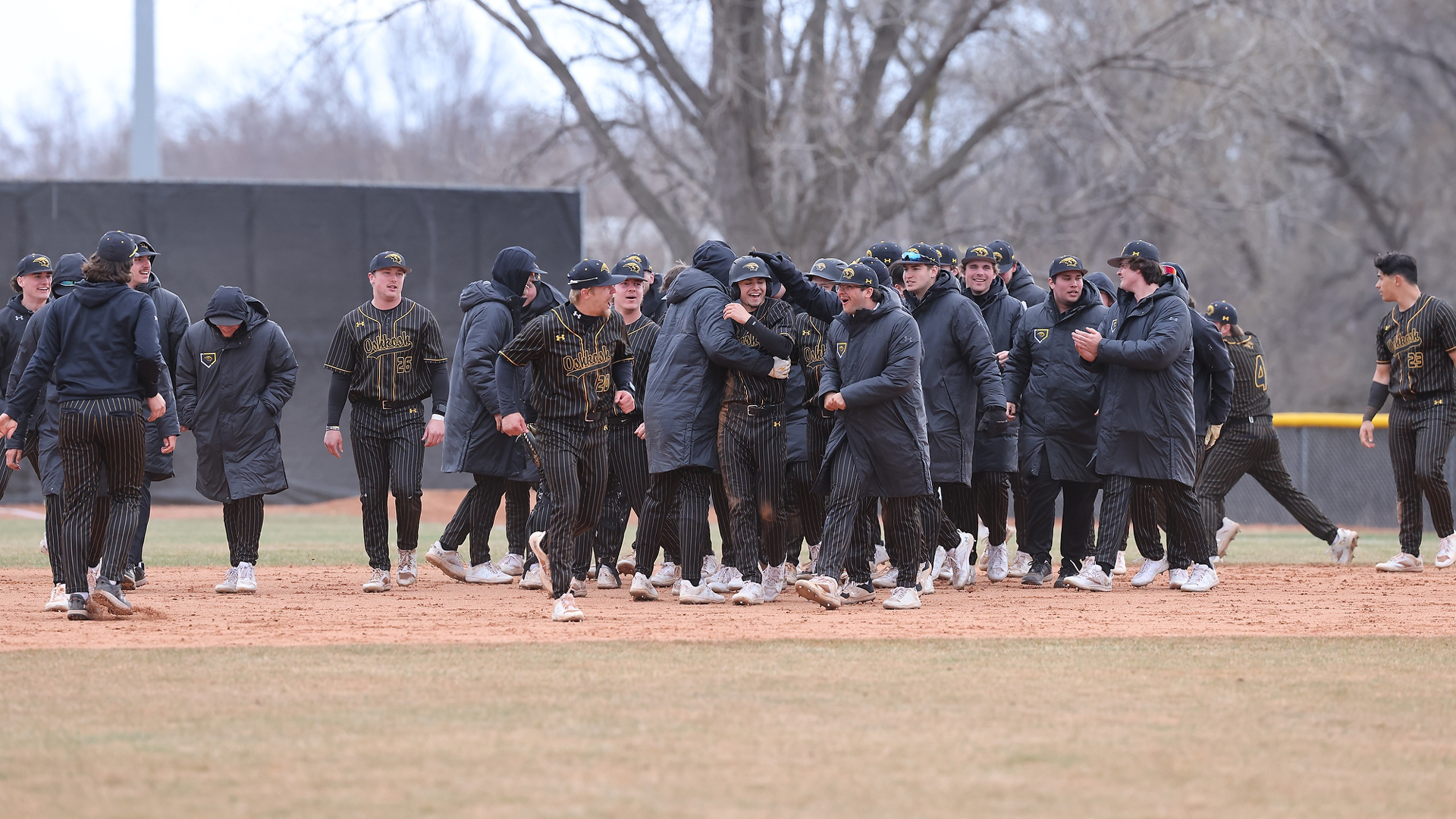 Titans celebrate after completing series sweep of Eau Claire. Photo Credit: Steve Frommell, UW-Oshkosh Sports Information