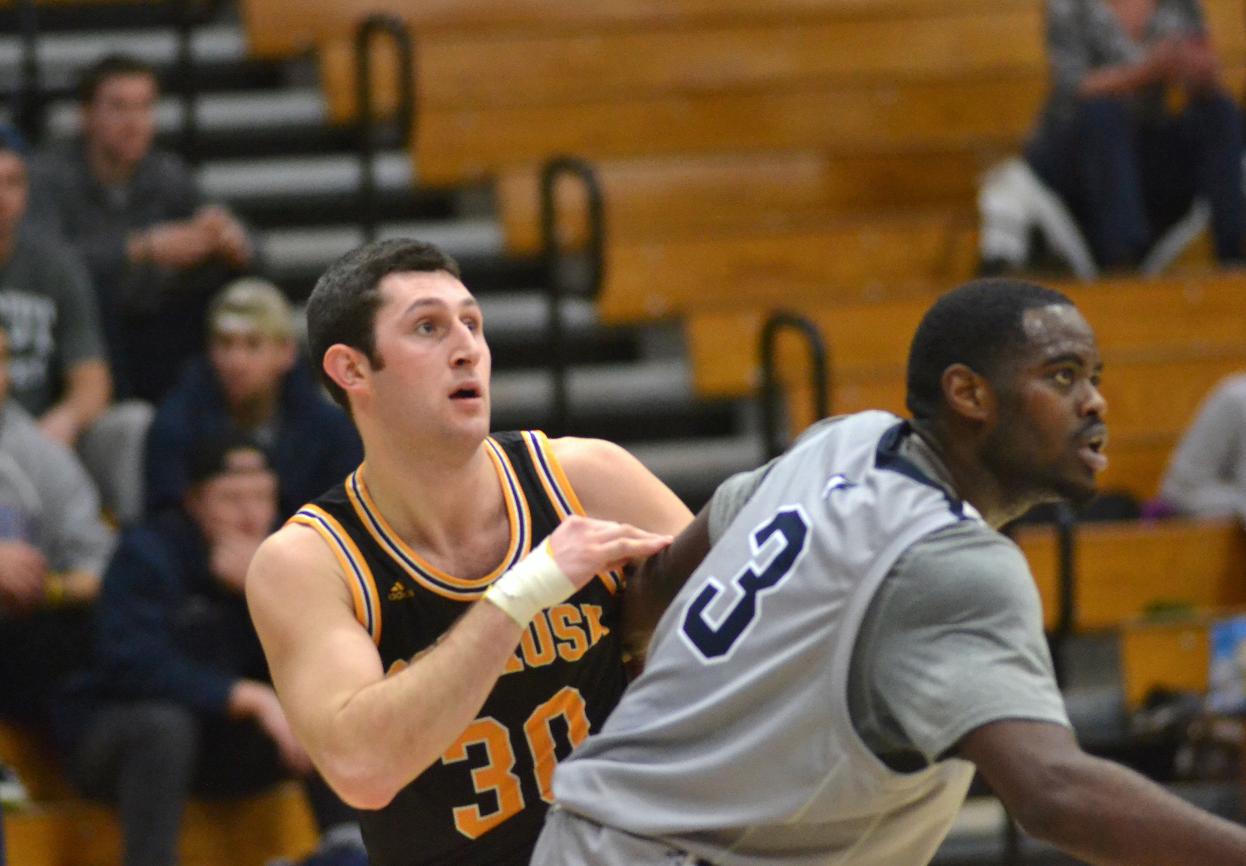 AJ Mueller scored four points and grabbed a team-high 11 rebounds to help the Titans even their WIAC record.