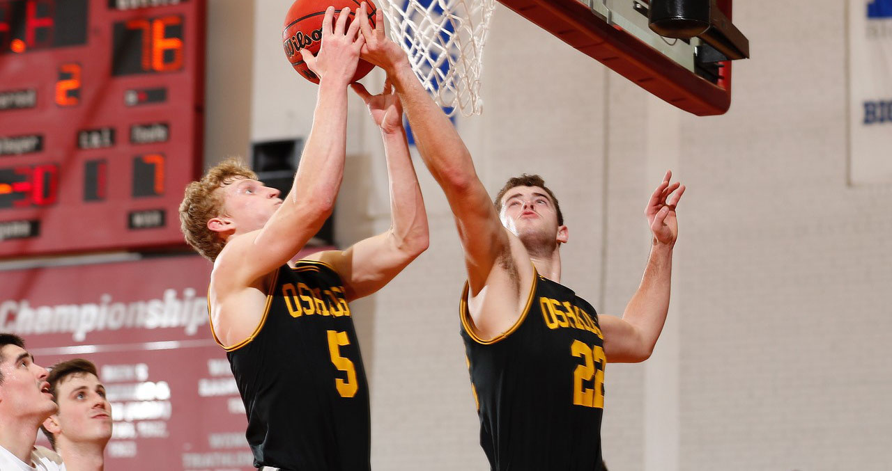 Connor Duax (left) and JT Petrie (right) combined for seven of UW-Oshkosh's 40 rebounds against the Cardinals.