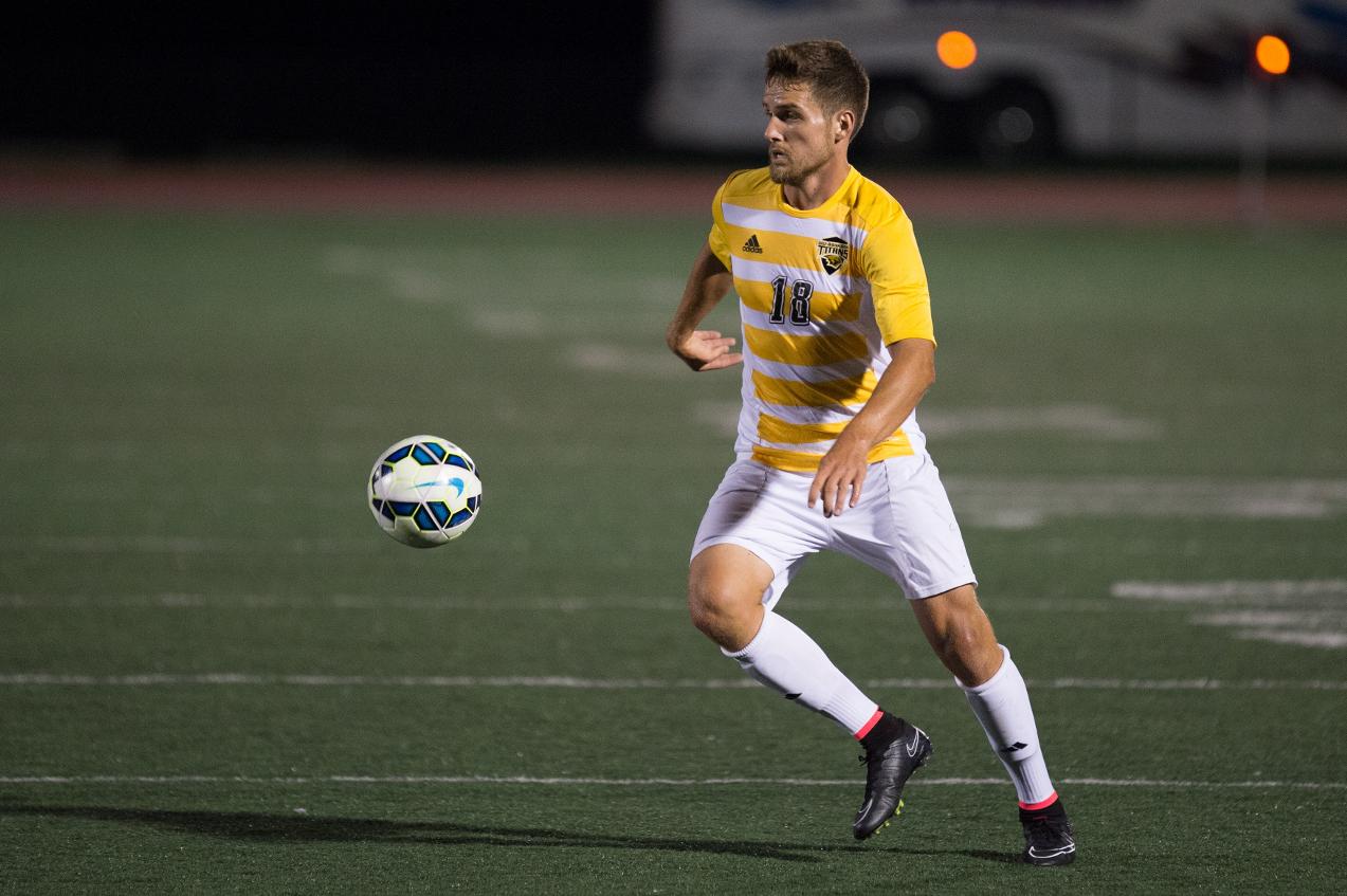 Jonathan Stanley's overtime goal lifted the Titans past the defending WIAC champion Yellowjackets.
