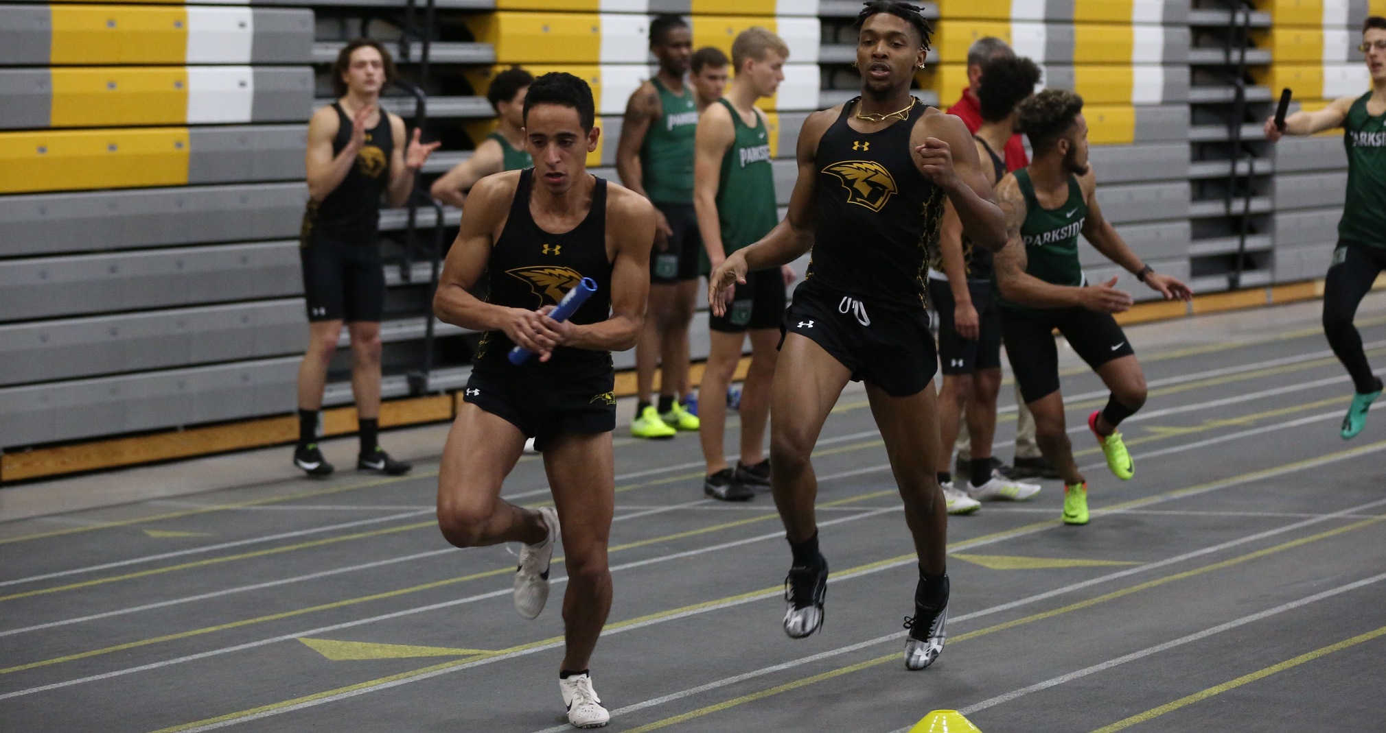 Steven Potter (front) and Amitai Wheat helped UW-Oshkosh record a winning time in the 1,600-meter relay.