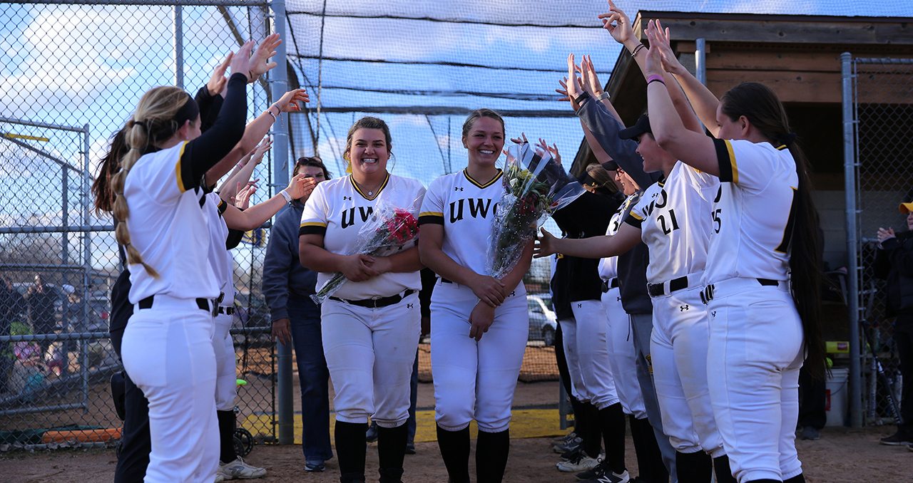 Kaitlyn Krol (left) and Abby Menting introduced on Senior Day.