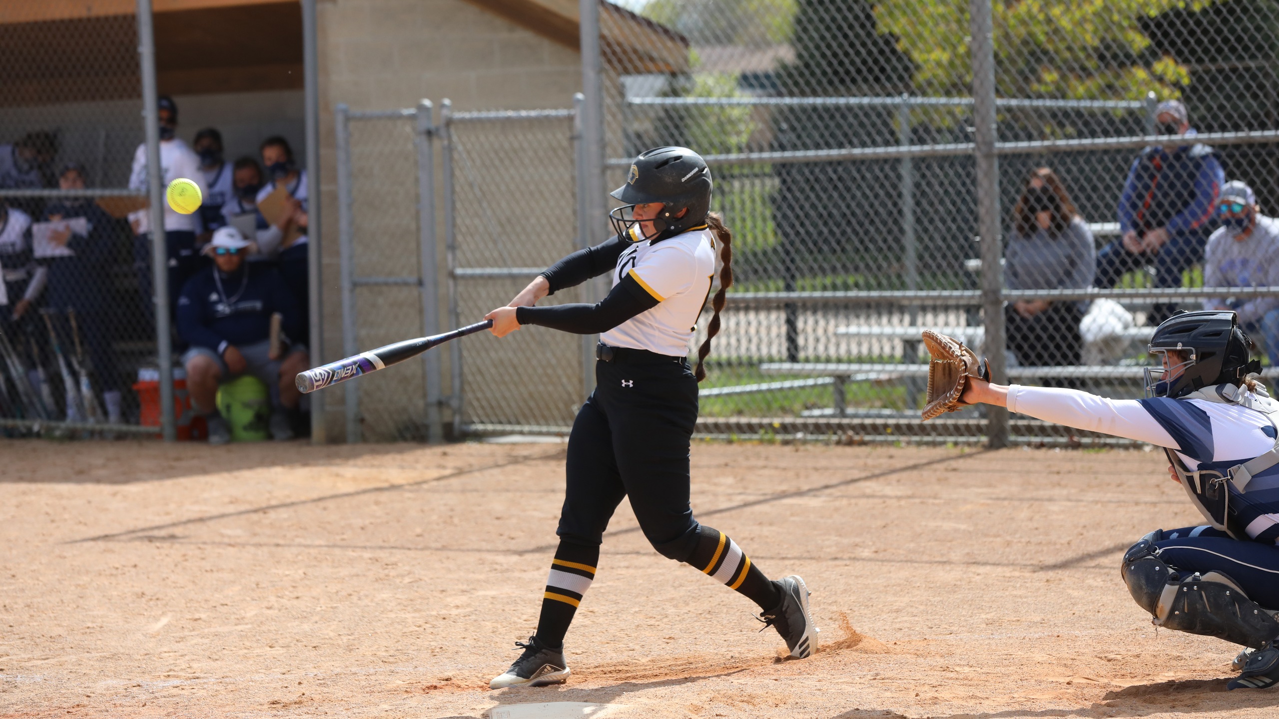 Acacia Tupa sent the Titans' game against the Blue Devils to extra innings by hitting a solo home run in the sixth inning and a two-run double in the seventh.