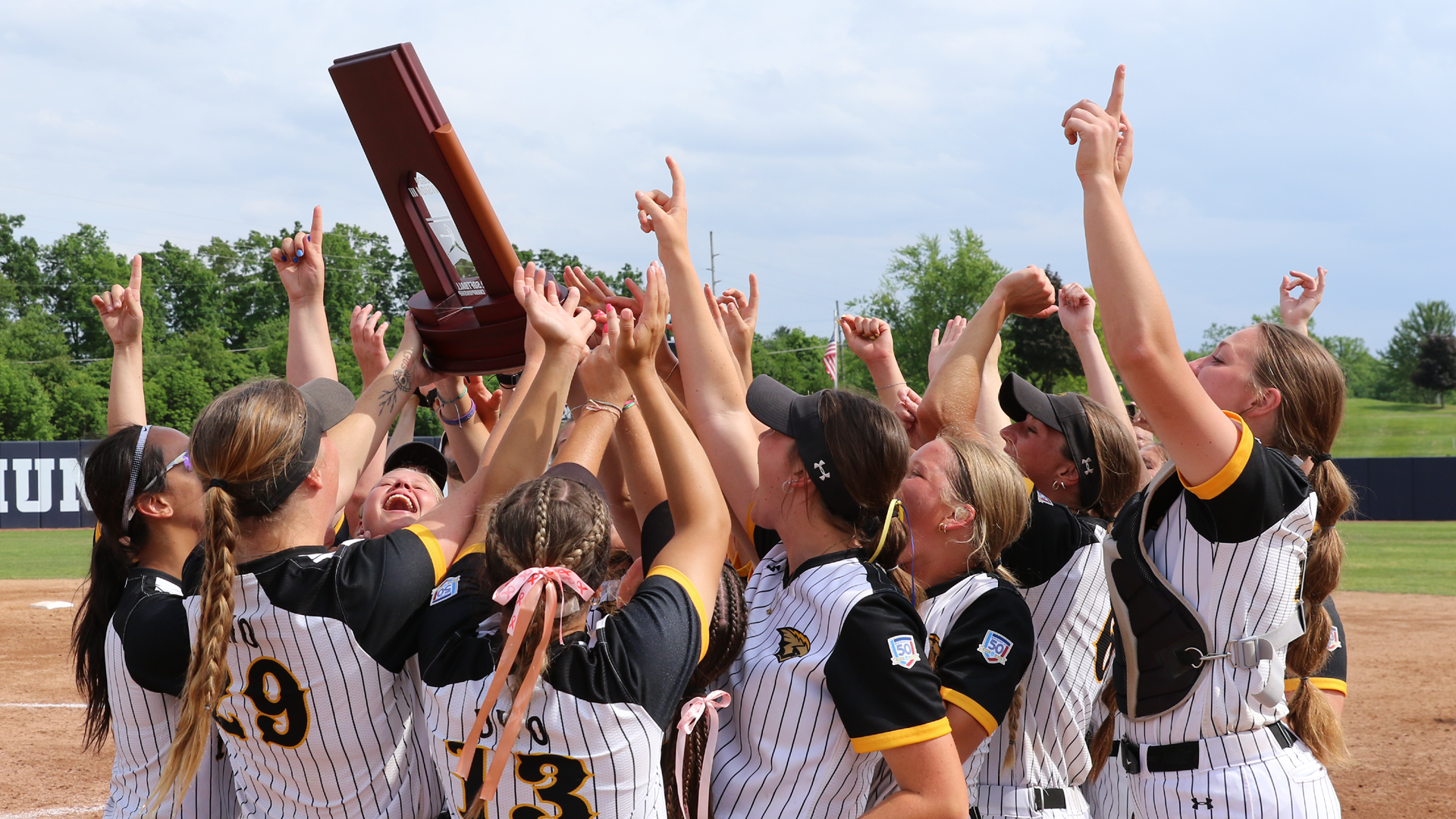 UW-Oshkosh Softball celebrating with the Super Regional trophy after defeating Trine on May 24. Photo Credit: Trine University