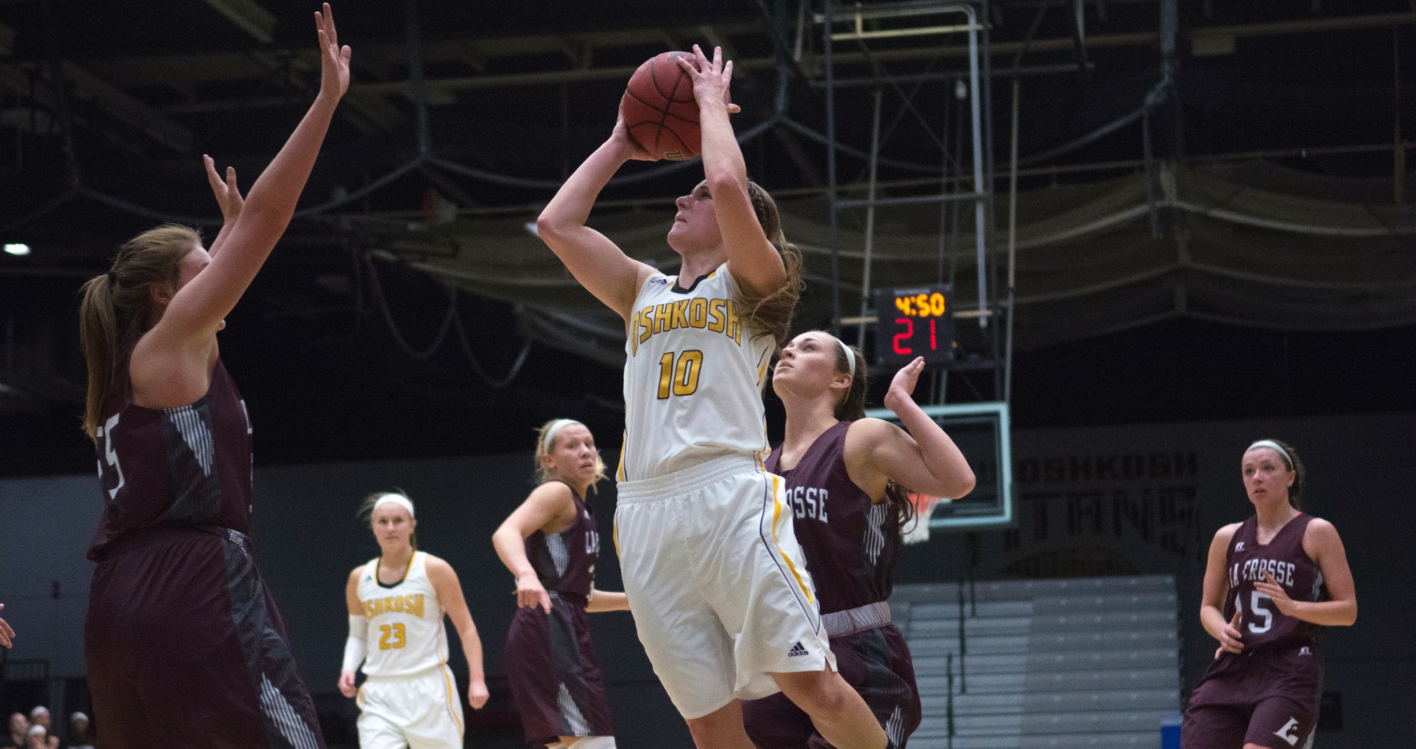 Taylor Schmidt scored the Titans' winning basket against the Eagles with 2.5 seconds left in overtime.