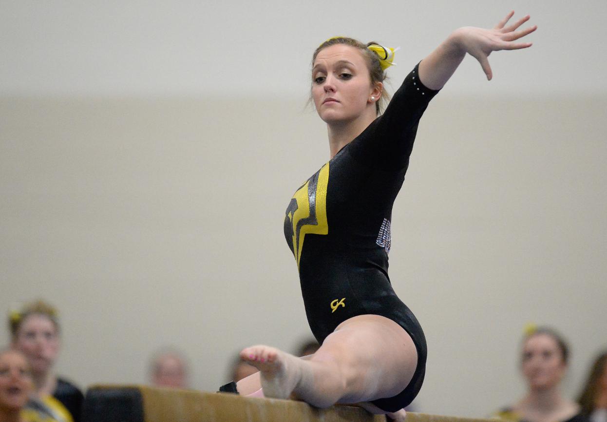 The Titans' Leane Blais took first place on the balance beam with 9.325 points and fourth on the uneven bars with 9.30.