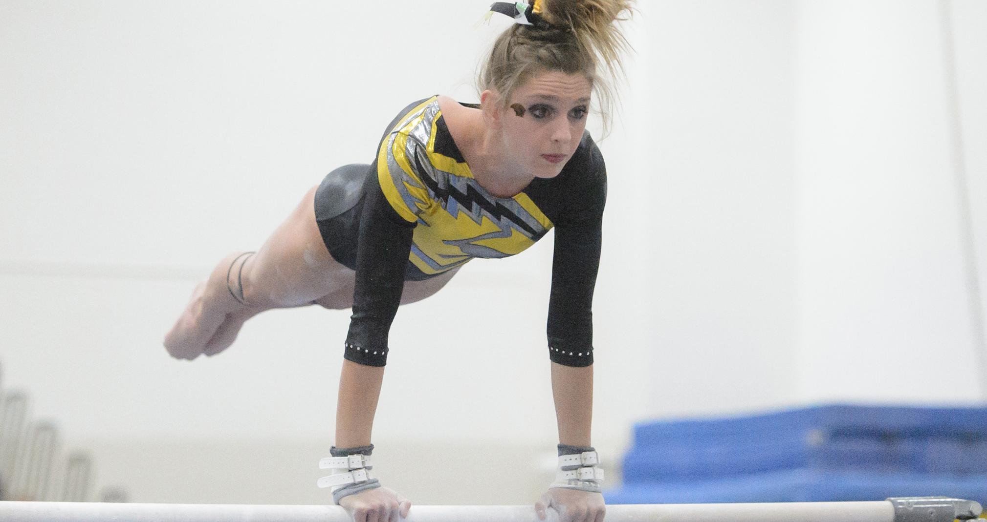 UW-Oshkosh swept the top three places on the uneven bars, including Emily Ryan's second-place listing.