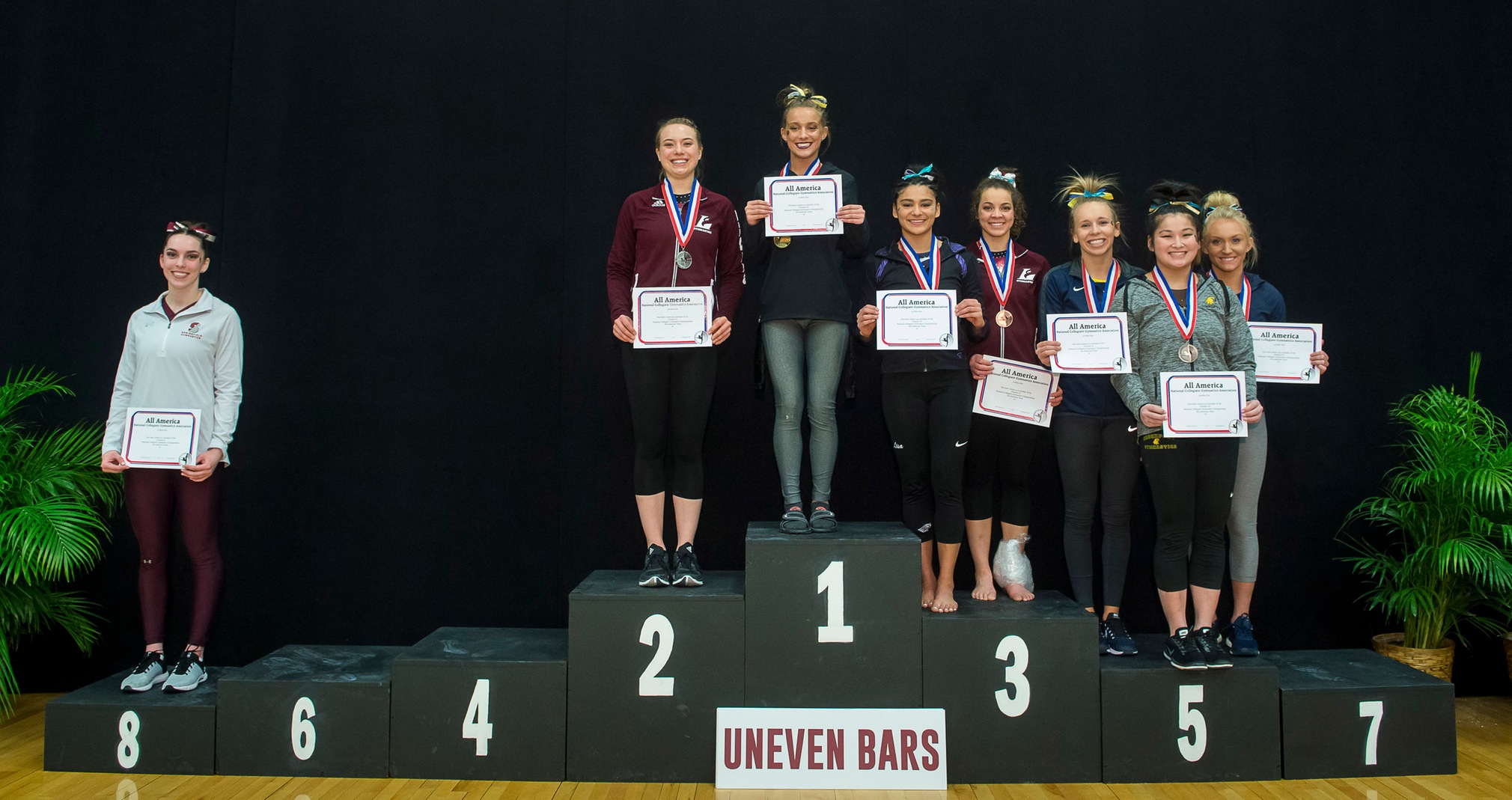Baylee Tkaczuk had a championship-record score on the way to defending her uneven bars national title.