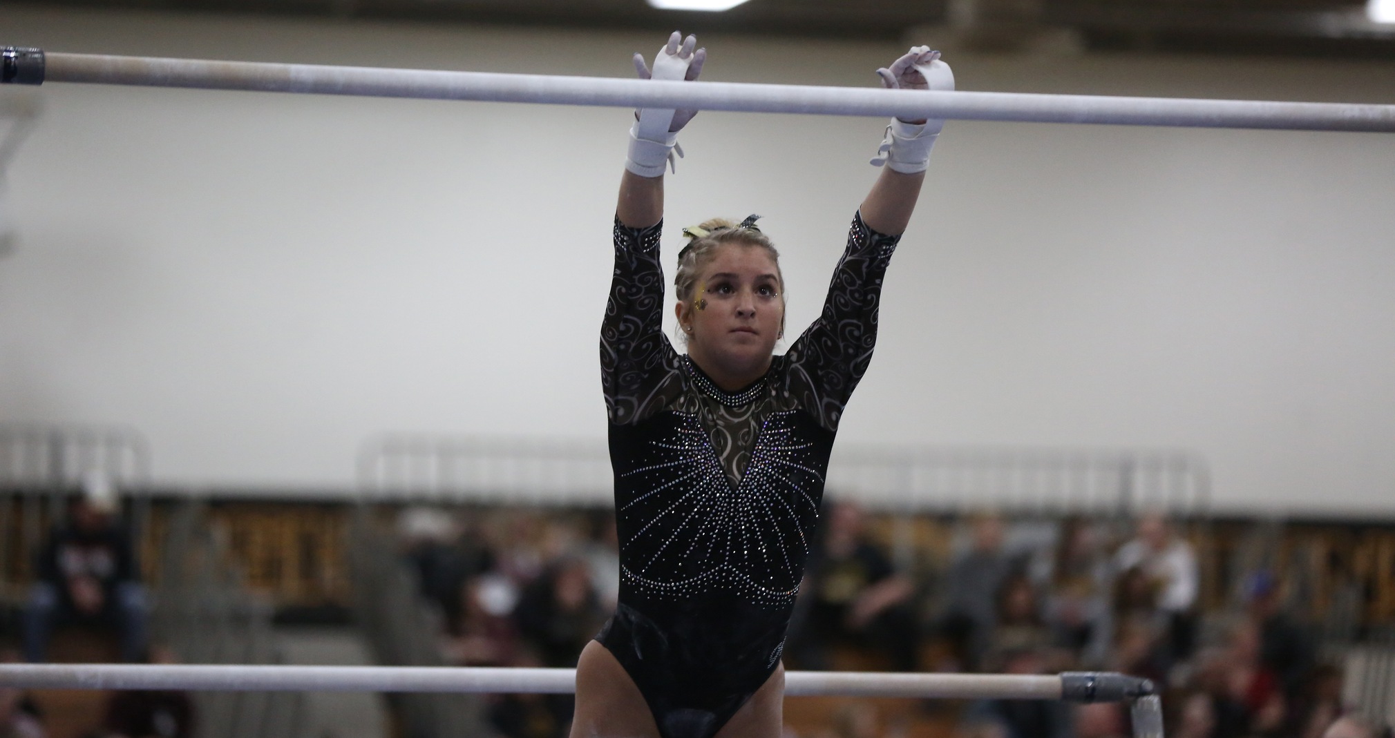 Emily Gilot recorded first-place finishes on the vault and the uneven bars against the Warriors.