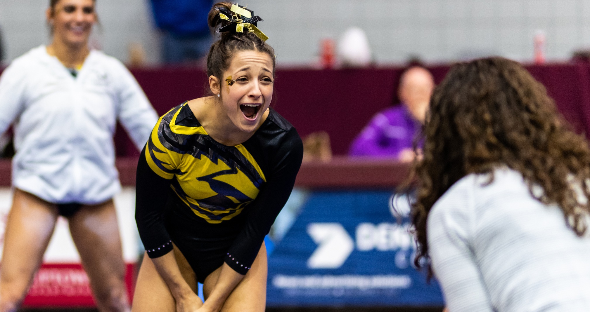 Olivia Keller celebrates after recording her second-place score of 9.775 on the balance beam.