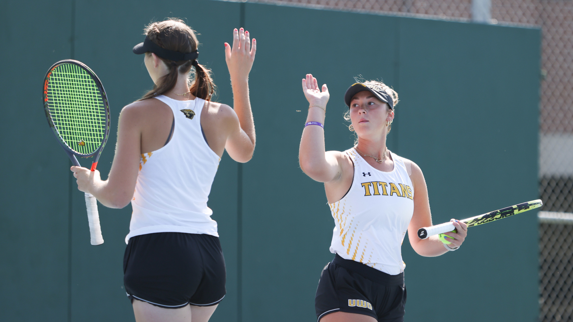 Kayla Gibbs (left) and Jameson Gregory (right) led UW-Oshkosh with a second-place finish in the No. 2 doubles bracket