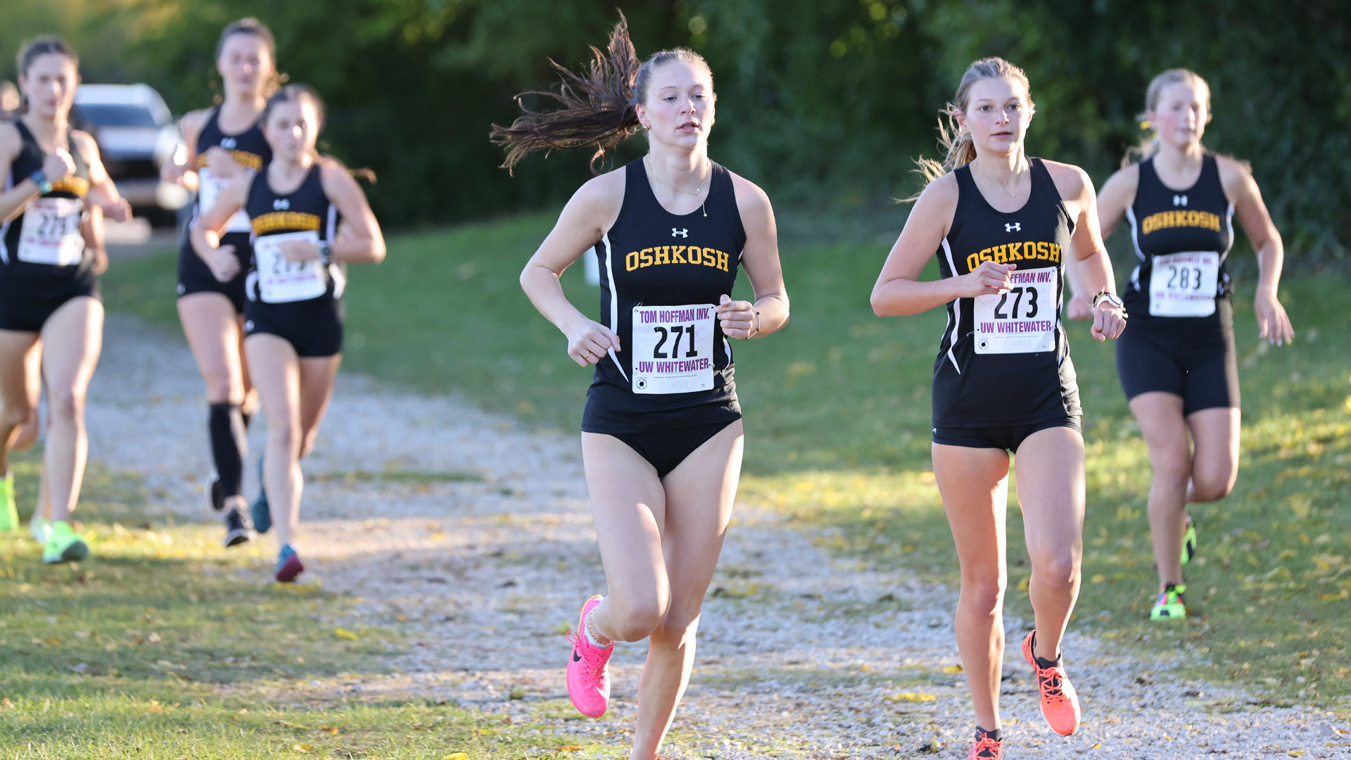 Meygan Benzing (center front), paced seven top-10 UW-Oshkosh finishers at the Warhawk Open with a third place, 25:19 performance